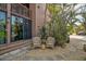 Inviting outdoor patio with comfortable seating surrounded by tropical plants and greenery at 105 Pass Key Rd # 105, Sarasota, FL 34242