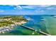 Stunning aerial view of a scenic bridge surrounded by the turquoise waters and lush greenery of the bay area at 1123 Riverscape St # D, Bradenton, FL 34208