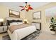 Relax in this bedroom featuring a neutral color palette, ceiling fan, and lots of natural light at 1123 Riverscape St # D, Bradenton, FL 34208