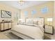 This bedroom features a neutral color palette, with lots of natural light and comfortable decor at 1123 Riverscape St # D, Bradenton, FL 34208