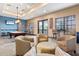 Billiard room with a pool table, lounge chairs, mounted television, and views to the exterior at 1123 Riverscape St # D, Bradenton, FL 34208