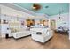 Spacious living room with modern furnishings, hardwood floors, and seamless flow to the kitchen and dining area at 1123 Riverscape St # D, Bradenton, FL 34208