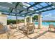 Relaxing outdoor lounge area featuring a grill, a pergola, comfortable seating, and a view of the pool at 1123 Riverscape St # D, Bradenton, FL 34208