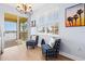 Cozy sitting area with elegant chandelier, natural light and views to the water from a screened lanai at 1123 Riverscape St # D, Bradenton, FL 34208