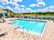 Sparkling community swimming pool with sun loungers, perfect for relaxation and recreation at 1123 Riverscape St # D, Bradenton, FL 34208