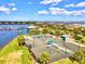 Overhead view of community tennis courts with nearby water views and manicured landscaping at 1123 Riverscape St # D, Bradenton, FL 34208