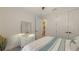 Neutral bedroom features an open closet, white dresser, and modern ceiling fan at 11606 Apple Tree Cir, Bradenton, FL 34211