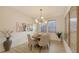 Cozy dining area with a round table, comfortable seating, and modern chandelier at 11606 Apple Tree Cir, Bradenton, FL 34211