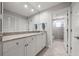 Bright bathroom featuring a granite countertop, undermount sink, and walk-in shower with glass enclosure at 1163 Coquille St # 207, Sarasota, FL 34242
