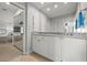 Bright bathroom with ample counter space, modern finishes, and access to a large mirror at 1163 Coquille St # 207, Sarasota, FL 34242
