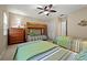 Bedroom featuring two twin beds, bunk beds, and an inviting, relaxed atmosphere at 1163 Coquille St # 207, Sarasota, FL 34242