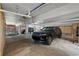 This garage features ample space for multiple vehicles and a cozy outdoor seating area at 1163 Coquille St # 207, Sarasota, FL 34242