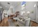 Open-concept living area with tall ceilings, plenty of natural light, and seamless flow into the dining area at 1163 Coquille St # 207, Sarasota, FL 34242
