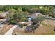 Aerial view of property with shed, spacious backyard, mature trees, and an extended driveway at 12103 Shadow Run Blvd, Riverview, FL 33569