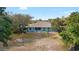 Spacious backyard showcasing lush greenery, mature trees, and ample space for outdoor recreation at 12103 Shadow Run Blvd, Riverview, FL 33569