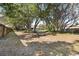 Spacious backyard with a perimeter fence and mature trees at 12103 Shadow Run Blvd, Riverview, FL 33569