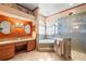Luxurious primary bathroom featuring dual sinks, a soaking tub, and a glass-enclosed shower at 12103 Shadow Run Blvd, Riverview, FL 33569