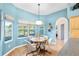Cozy breakfast nook with a round table, bay window, and plenty of natural light at 12103 Shadow Run Blvd, Riverview, FL 33569