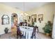 Elegant dining room with chandelier, table, and chairs for Gathering gatherings and dinner parties at 12103 Shadow Run Blvd, Riverview, FL 33569