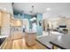 Bright kitchen with a center island, stone countertops, stainless steel appliances, and lots of storage at 12103 Shadow Run Blvd, Riverview, FL 33569
