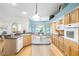 Spacious kitchen featuring a center island, updated appliances, and a large window for natural light at 12103 Shadow Run Blvd, Riverview, FL 33569