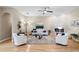 Well-lit living room boasts hardwood floors, modern fireplace, and elegant decor with natural light at 12103 Shadow Run Blvd, Riverview, FL 33569