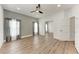 Bright and spacious living room with hardwood floors and modern lighting at 12319 Hollybush Ter, Lakewood Ranch, FL 34202