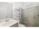 Modern bathroom with a walk-in shower, sleek vanity, and stylish fixtures at 12557 Galapagos Ct, Venice, FL 34293