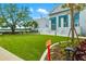 Beautiful community clubhouse surrounded by manicured lawn and landscaping at 12557 Galapagos Ct, Venice, FL 34293