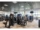 Spacious fitness center equipped with state-of-the-art exercise machines and large windows at 12557 Galapagos Ct, Venice, FL 34293