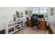 Home office with a large wooden desk, ample storage, and a window overlooking the landscape at 12557 Galapagos Ct, Venice, FL 34293