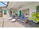 Inviting covered patio with stylish furniture, perfect for outdoor relaxation and entertaining at 12557 Galapagos Ct, Venice, FL 34293
