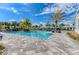 Inviting community pool area featuring comfortable seating and palm tree accents at 14277 Skipping Stone Loop, Parrish, FL 34219