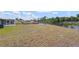 Generous backyard overlooking a tranquil waterfront setting at 1665 Harmony Dr, Port Charlotte, FL 33952