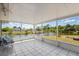 Enclosed porch featuring tile floors, screens, and an outdoor view at 1665 Harmony Dr, Port Charlotte, FL 33952