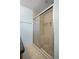 Modern shower with glass door, tile surround and built-in seat at 1665 Harmony Dr, Port Charlotte, FL 33952