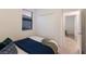Bright bedroom features a window, closet, and access to another room at 20892 Cattail Blvd, Venice, FL 34292