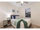 Comfortable bedroom with ceiling fan, modern nautical decor and natural light at 20892 Cattail Blvd, Venice, FL 34292