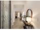 Elegant foyer with a decorative mirror and table provides a welcoming entrance to the home at 20892 Cattail Blvd, Venice, FL 34292