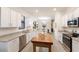 Spacious kitchen showcases an island, stainless appliances, granite counters, and ample cabinetry at 20892 Cattail Blvd, Venice, FL 34292