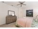 Comfortable main bedroom featuring a large dresser and view of the en suite bath at 20892 Cattail Blvd, Venice, FL 34292