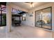 Spacious patio with seating leads to a sliding glass door accessing the home's interior at 20892 Cattail Blvd, Venice, FL 34292
