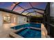 Inviting screened-in pool and spa offer a relaxing outdoor retreat adjacent to a patio at 20892 Cattail Blvd, Venice, FL 34292