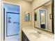 Bathroom features a modern shower, updated lighting, and quartz countertops at 22235 Panther Loop, Bradenton, FL 34202