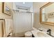 Bathroom featuring a single vanity, tile floors, and a shower with a curtain at 22235 Panther Loop, Bradenton, FL 34202