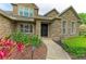 Close-up of the ornate front door and professionally landscaped entrance at 22235 Panther Loop, Bradenton, FL 34202