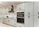 Kitchen featuring stainless steel appliances, tile backsplash, and light cabinets at 22235 Panther Loop, Bradenton, FL 34202