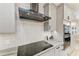 Kitchen featuring stainless steel hood vent and gas cooktop at 22235 Panther Loop, Bradenton, FL 34202