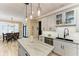 Kitchen featuring center island with gray marbled countertop, stainless steel sink at 22235 Panther Loop, Bradenton, FL 34202