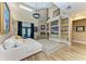 Bright living room boasts a soaring ceiling and custom built-in shelving at 22235 Panther Loop, Bradenton, FL 34202